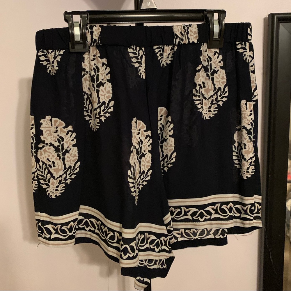 black shorts with white and cream designs